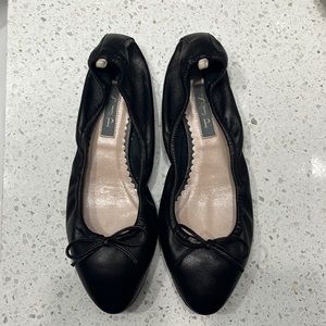 SJP black flats